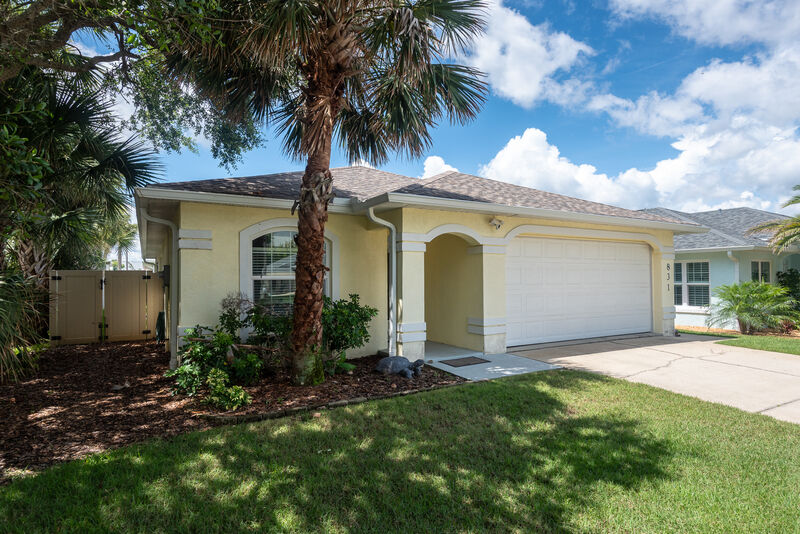 Curb appeal under the palms — the Lighthouse, New Smyrna Beach