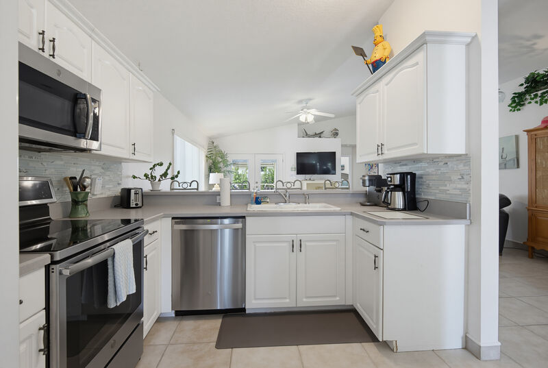 Stainless appliances & stone counters — the Lighthouse, New Smyrna Beach